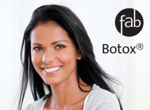 Pretty middle-aged woman depicted to be showing off her smooth skin after Botox treatment.