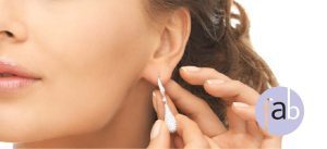 Woman demonstrating area ear lobe repair typically performed.